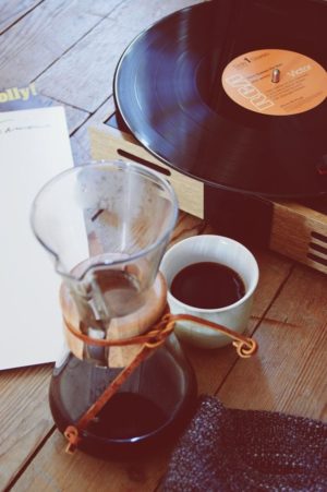 vinyl player and a coffee in warm tones
