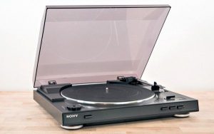 turntable on the table with dust cover open